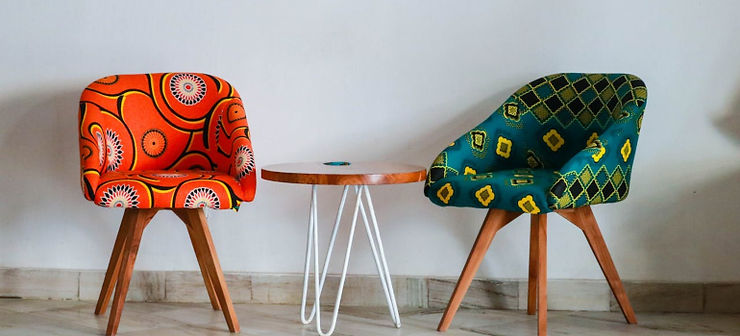 two chairs and a coffee table in a room 