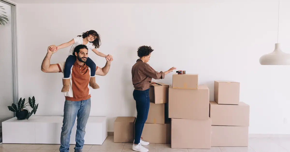 Family preparing for a move with packed boxes and cleaning before the movers arrive.