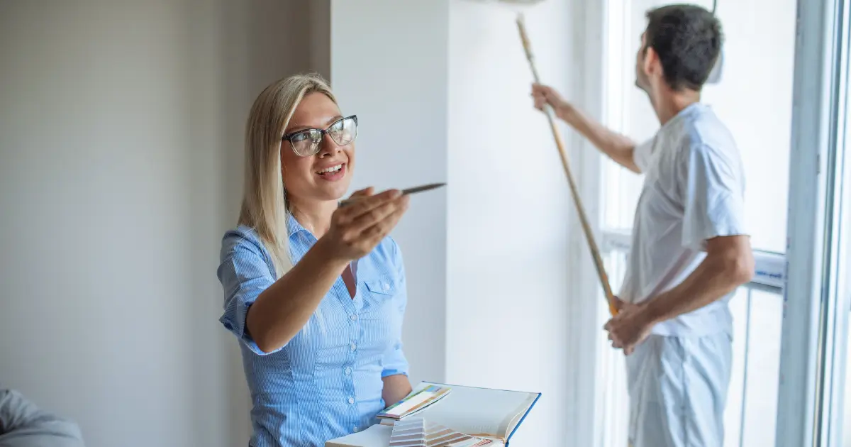 Property manager reviewing a freshly cleaned rental home with a professional cleaner preparing the space for tenants