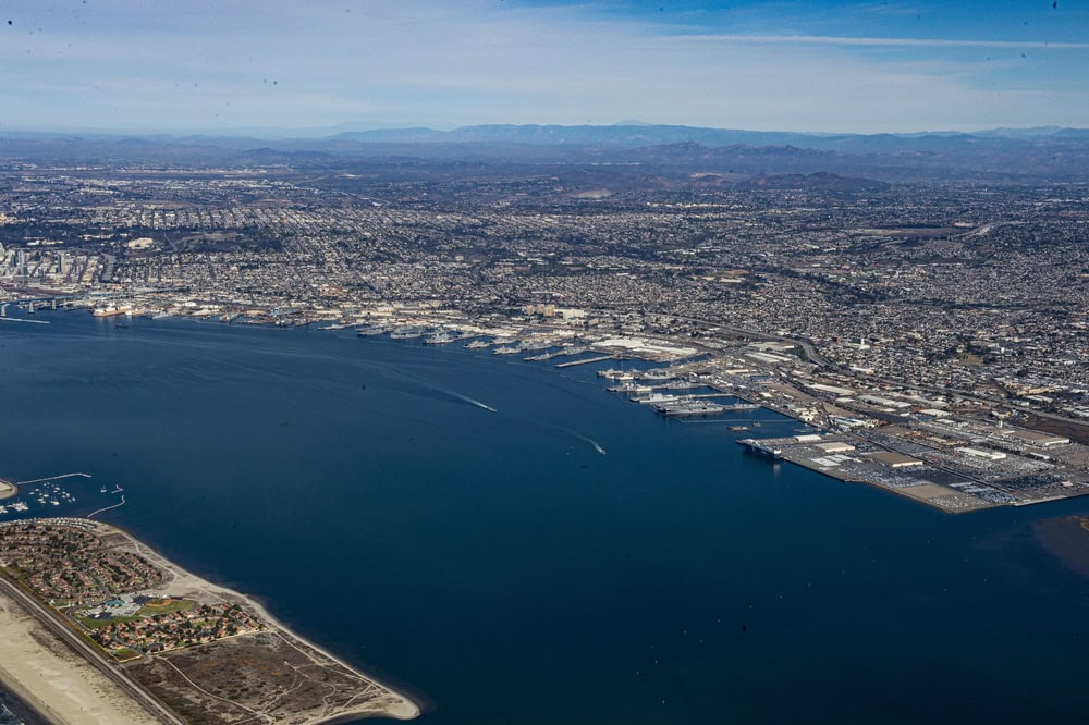 Aerial view of ships and piers at Naval Base San Diego